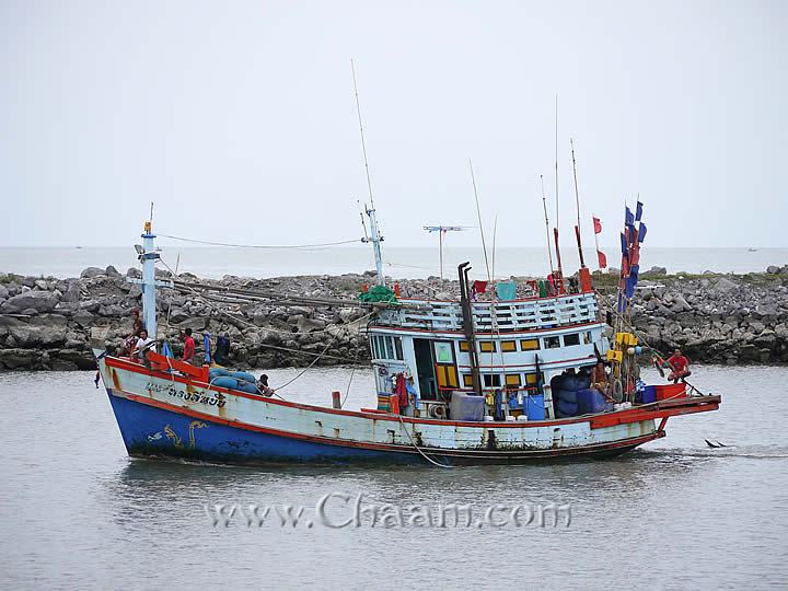 Fishing boat drives in harbor of Cha-Am
